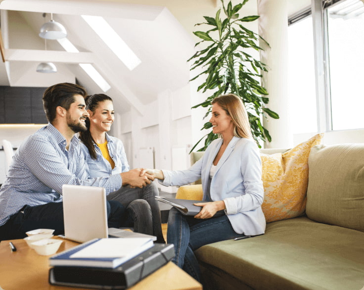 Couple shaking hand with a woman